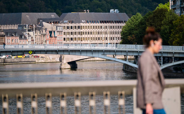 Liège, Belgium - October 10, 2021: Person crosses bridge, focus on bridge in background