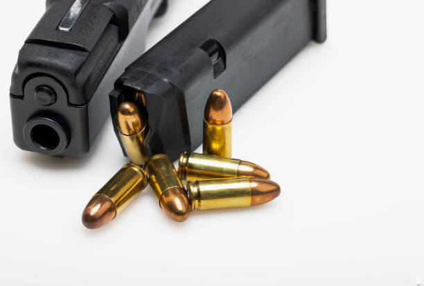 istock Gun bullets and magazine with semi automatic handgun on white background 1345640288