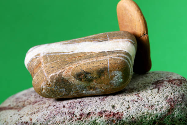 istock close-up zen stones on green background 1345642415