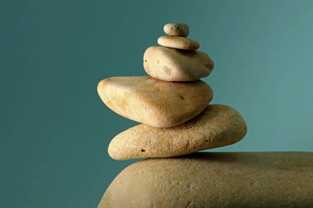 istock close-up zen stones on green background 1345642508