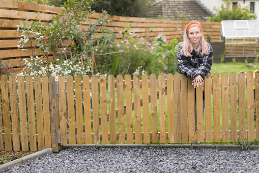 Suburban lady in her garden.