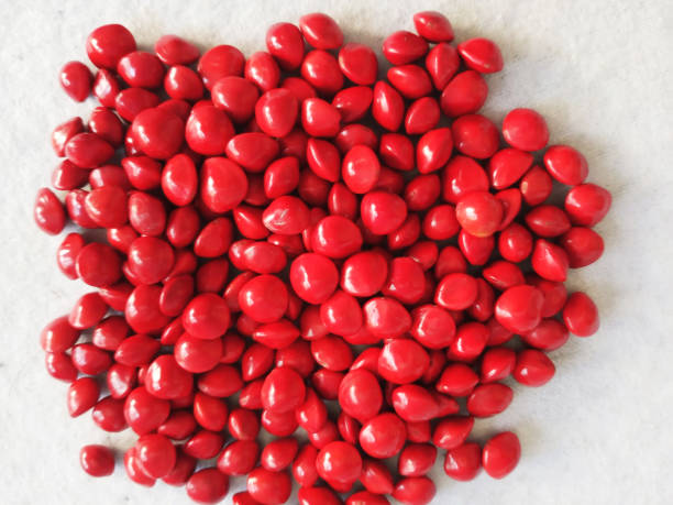 istock heart shape background Saga Seed/Acacia beans red in colour 1345644365
