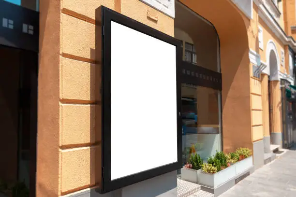 Isolated poster mockup on street building wall