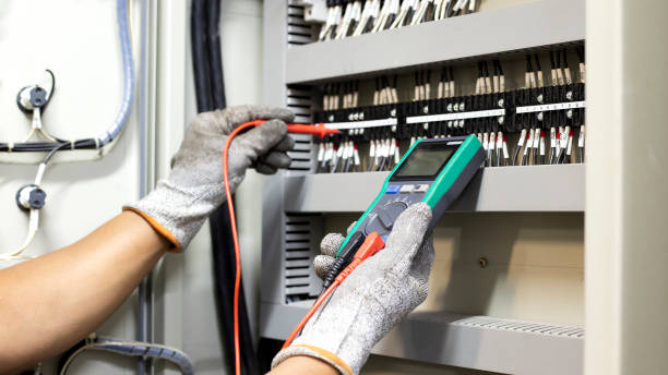 istock Electrical engineer tests the operation of the electric control cabinet on a regular basis for maintenance. 1345645709