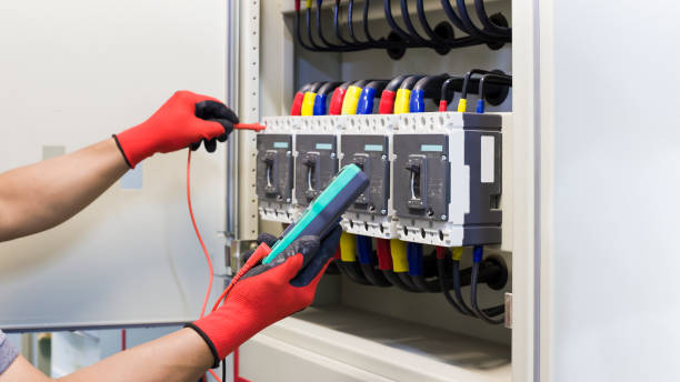 istock Electrical engineer tests the operation of the electric control cabinet on a regular basis for maintenance. 1345645747