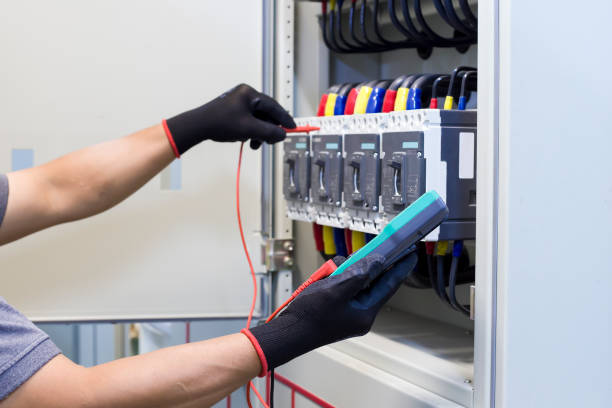 istock Electrical engineer tests the operation of the electric control cabinet on a regular basis for maintenance. 1345645767