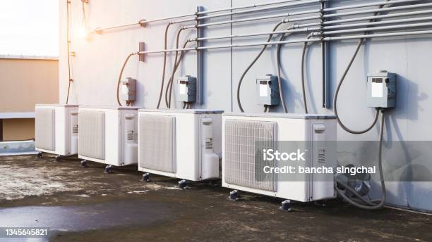 Air Condition Outdoor Unit Compressor Install Outside The Building Stock Photo - Download Image Now