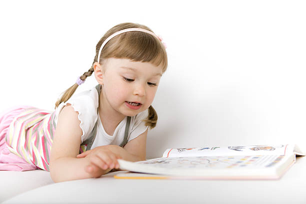 istock little girl reading book 134564661