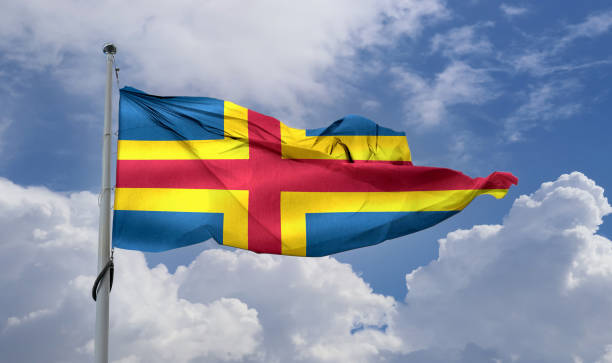 istock Aland Islands flag - realistic waving fabric flag 1345646927