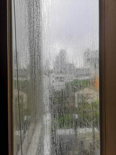 istock Heavy rain in Bangkok from apartment window 1345647025