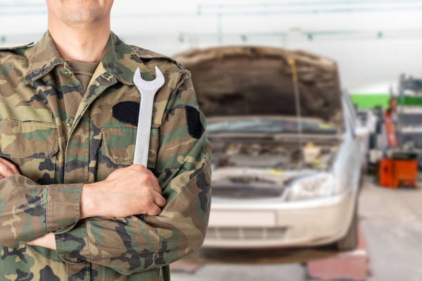 militar man car mechanic with wrench