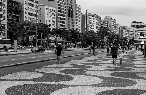 Rio de Janeiro city, Rio de Janeiro state, Brazil October 05, 2021:People exercising in the morning on the sidewalk of the famous Copacabana avenue.