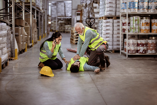 Warehouse workers after an accident in a warehouse