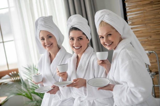 istock Three adorable adult girlfriends in spa 1345651438