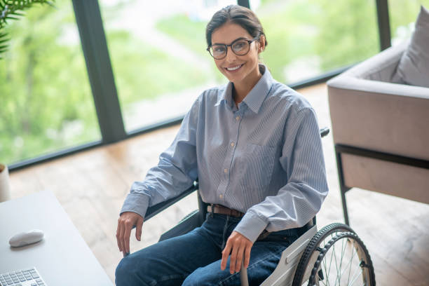 istock A disabled young woman looking contented and smiling nicely 1345652572