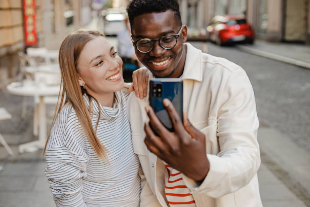 istock Friends taking selfie on the street 1345658871