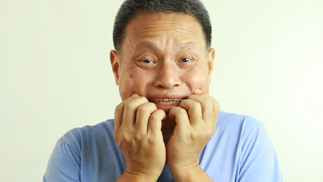 Thai man is frightening  with white background