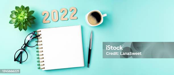 New Year 2022 Goals On Desk 2022 Resolutions With Open Notebook Coffee Cup Eyeglasses Plant Succulent On Green Background Goals Resolutions Plan Strategy Idea Concept New Year 2022 Stock Photo - Download Image Now