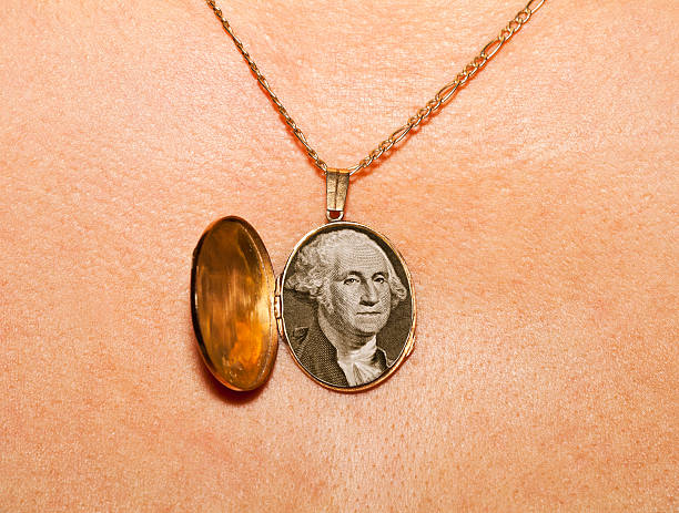 gold medallion Gold locket with a picture of George Washington in women's breasts. locket stock pictures, royalty-free photos & images