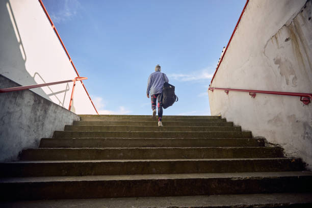 istock Fit woman jogging alone outside 1345667781