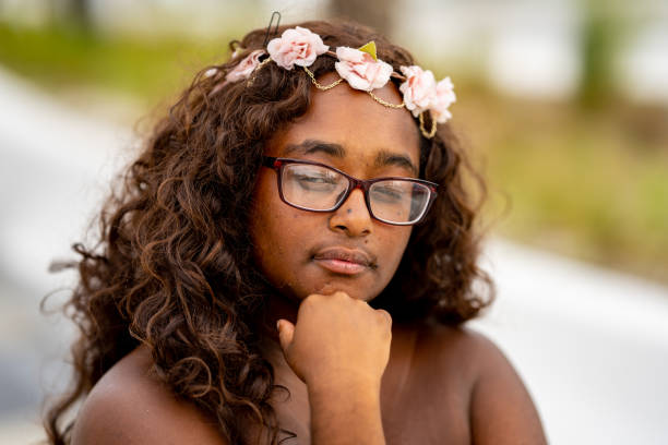 istock Beautiful natural multiracial female posing outdoors on blurry background 1345669374