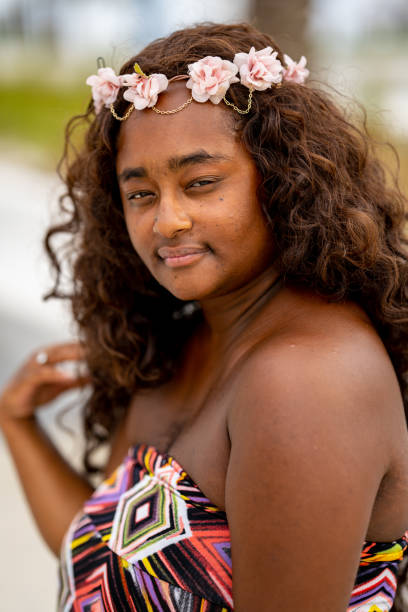 istock Beautiful natural multiracial female posing outdoors on blurry background 1345669418