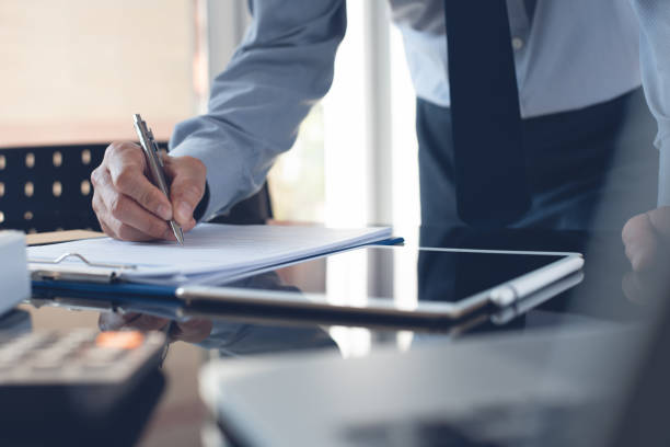 istock Businessman working in office, signing business contract 1345669519