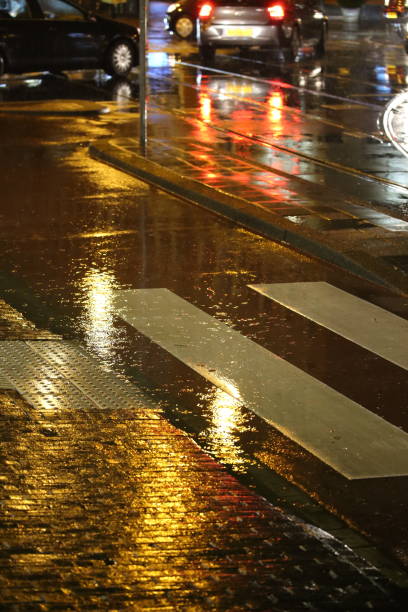 istock rain in the streets at night 1345673159