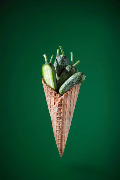 istock Cucumber on a green bacground 1345673303