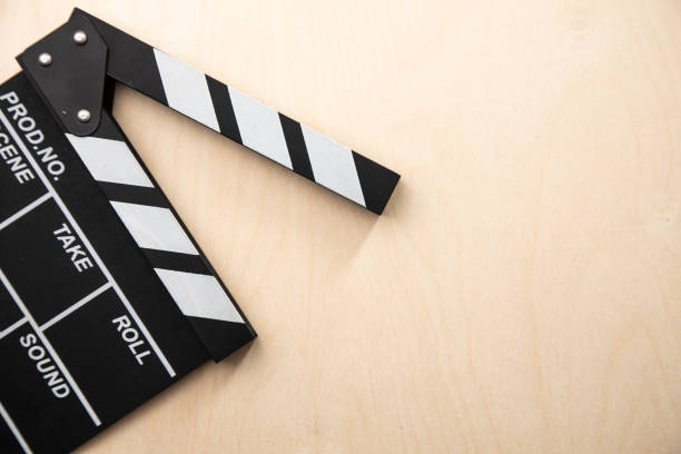 istock movie board on wooden background 1345674516