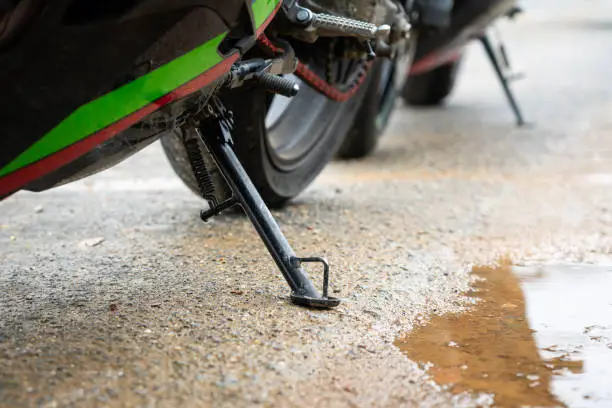 Superbike standing pod which is using the stable the bike during parking on the road. Vehicle equipment object part. Close-up and selectic focus.