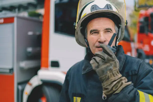 Photo of Firefighter using walkie talkie