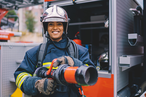 Firefighter with work helmet looking at camera