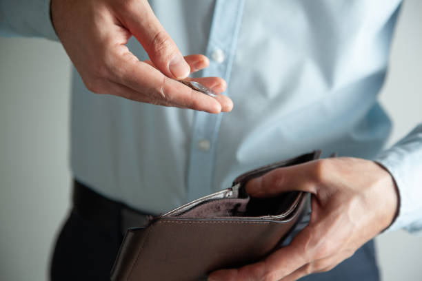 istock wallet in the hands of a man 1345679986