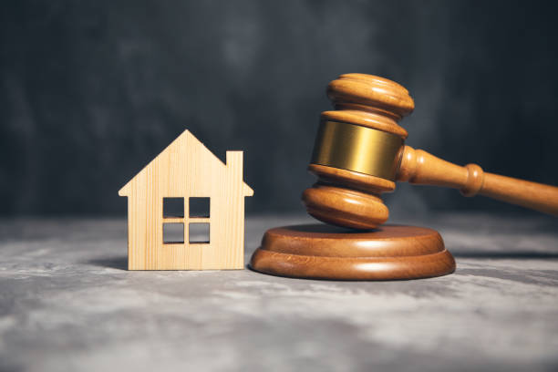 istock Judge gavel and house model 1345680016