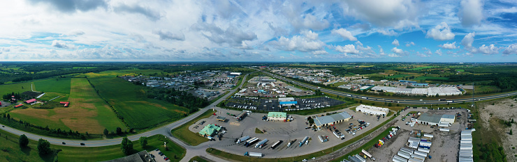 An aerial panorama view of busy expressway by truck stop