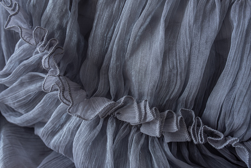 una parte del vestido gris como fondo para tus ideas photo