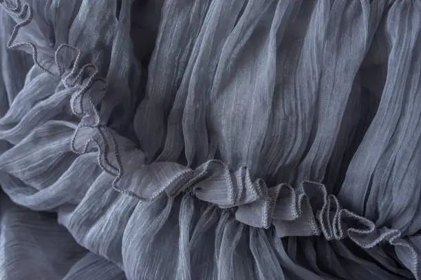 Photo of a part of gray dress as a background for your ideas