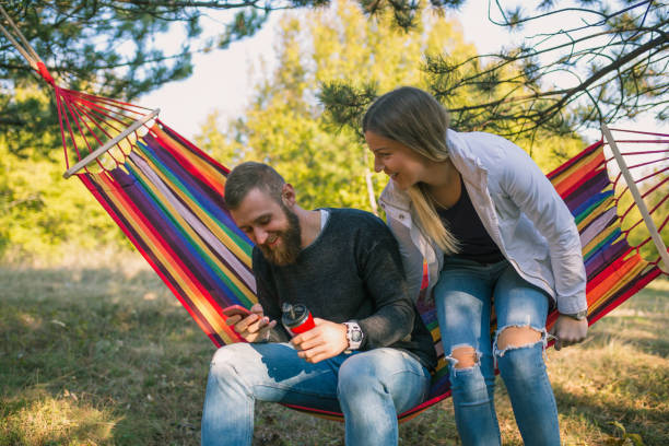 istock Young couple enjoy in hammock 1345680298