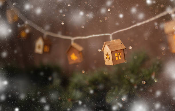 View of christmas tree garland. Christmas time ideas for greeting card. Garland in the form of small houses. Christmas time ideas for greeting card. rust germany stock pictures, royalty-free photos & images
