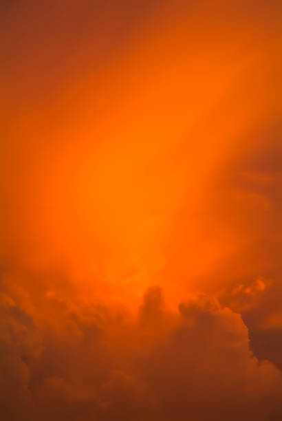 Colorful sunset sky with dramatic orange clouds. Only sky, no land.