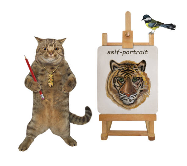 istock Cat artist paints his self-portrait 3 1345680669