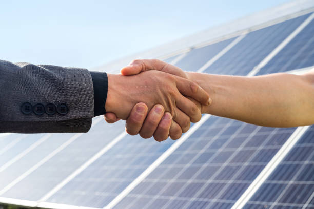foreman and businessman shaking hands after meeting and over deal their agreement or contract - solar panel imagens e fotografias de stock