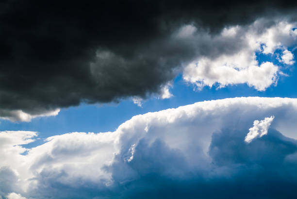 istock Cumulus clouds in the blue sky. No land view. 1345684937