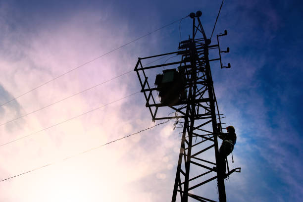 Electrician worker climbing electric power pole Power line support,Technology maintenance and development industry concept maintenance engineer fuel and power generation power line electricity stock pictures, royalty-free photos & images