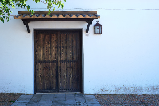 detail of an antique wooden door of a Castilian house