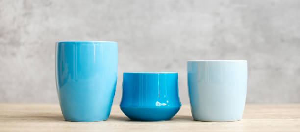 istock Blue coffee cup and tea mug on wood table background in the morning, Blank copy space for text. International coffee day and daily routine concept 1345688487