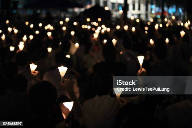 Finding The Light In Dark A Haza Candlelight Vigil Find Each Other In Darkness Blur Background In Hong Kong Victoria Park Stock Photo - Download Image Now