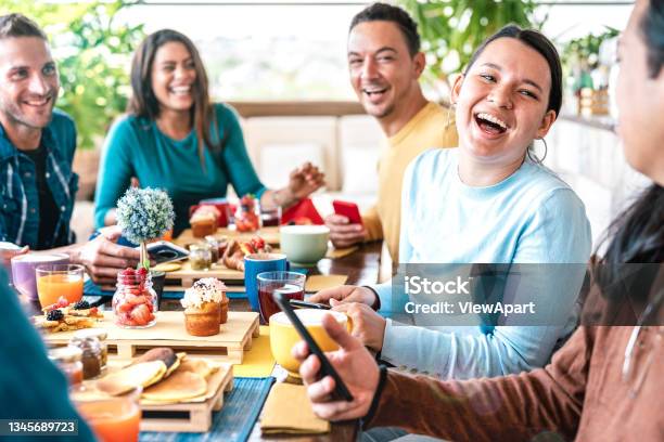 People Group Talking At Coffee Bar Restaurant Friends Having Fun Together At Rooftop Cafeteria On Brunch Time Life Style Concept With Happy Men And Women At Cafe Venue Stock Photo - Download Image Now