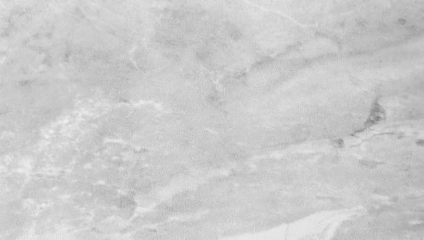 istock light grey marble texture background showing beautiful mineral veins. rustic marble texture, natural grey marble stone for interior flooring work. 1345690608